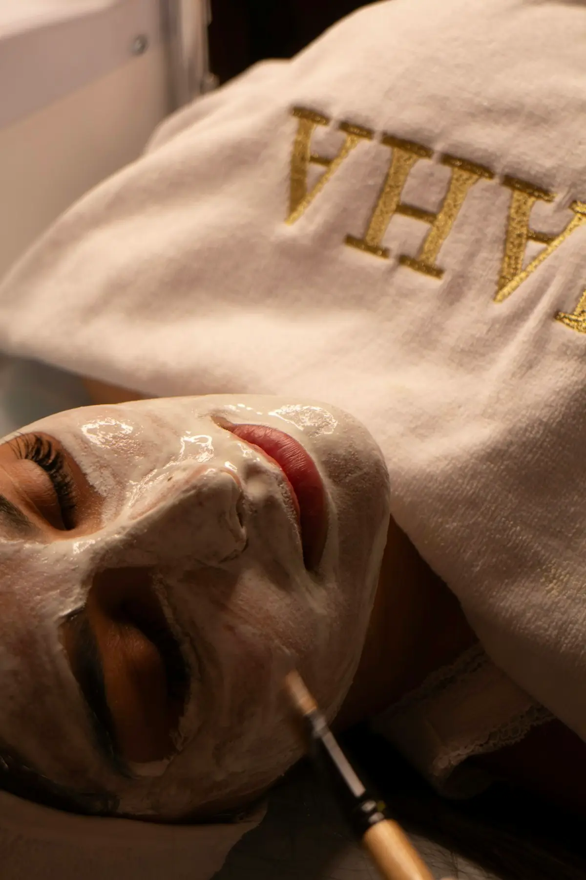 Peel treatment being brushed onto a client's face